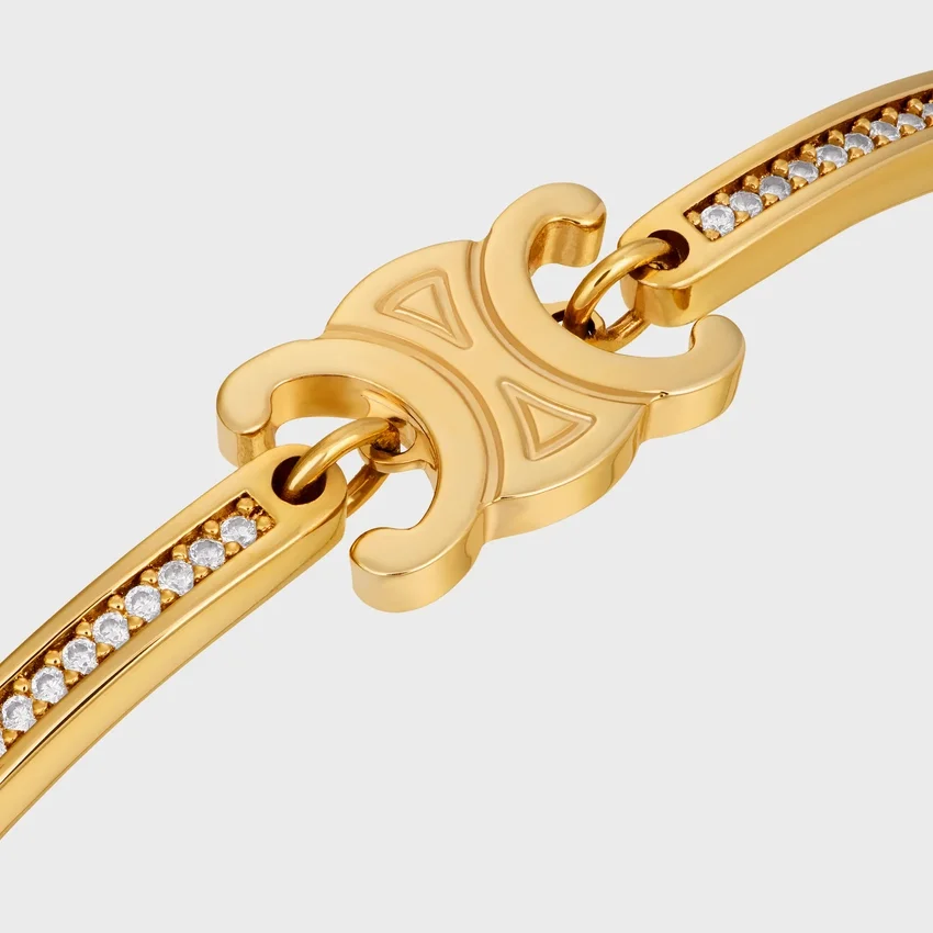 Triomphe ledat glittrande armband i strass och mässing med guldfinish - Bild 4
